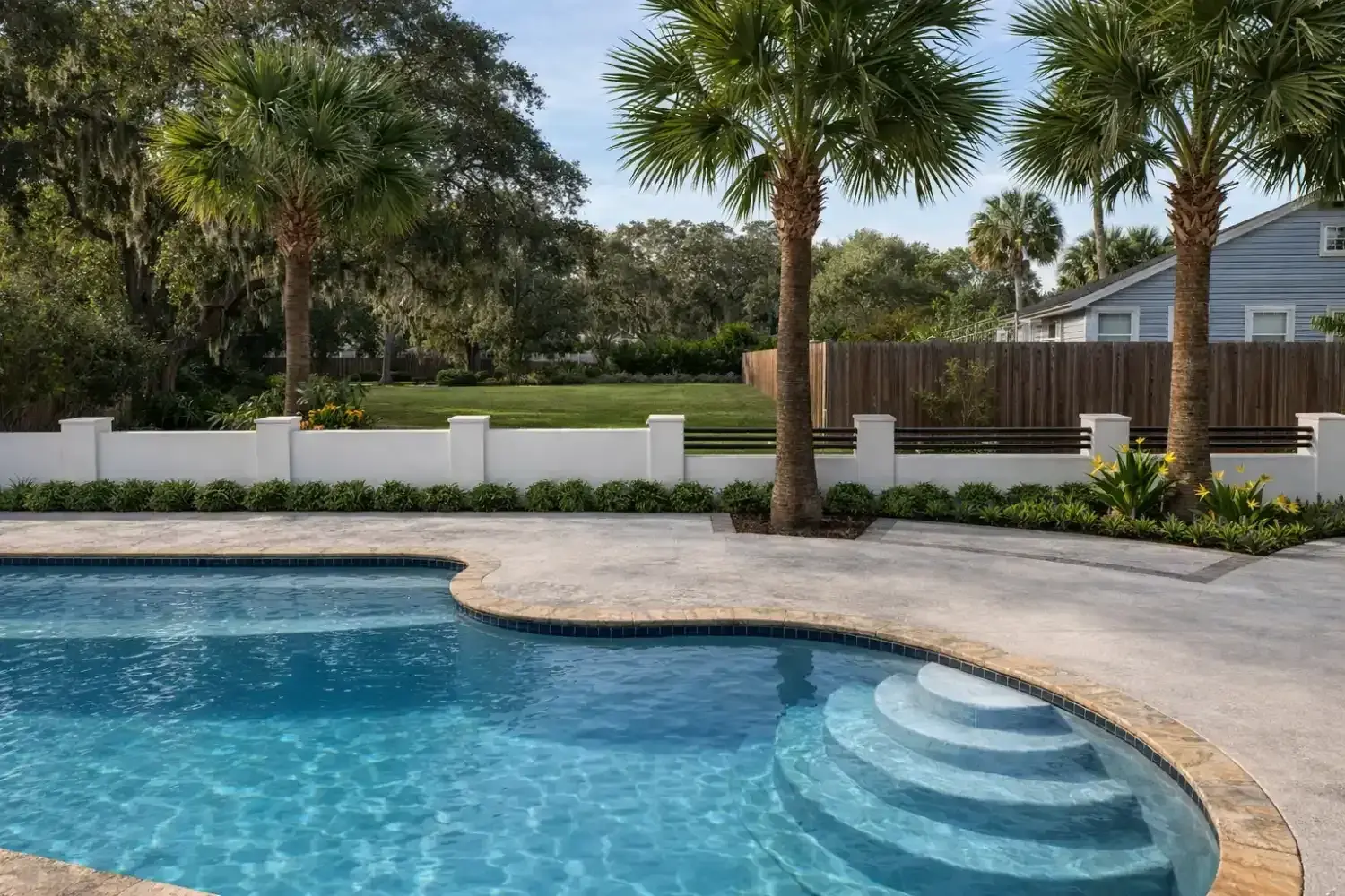 3D rendering: curved entry steps into a freeform amenity pool, with a white pillared fence beyond