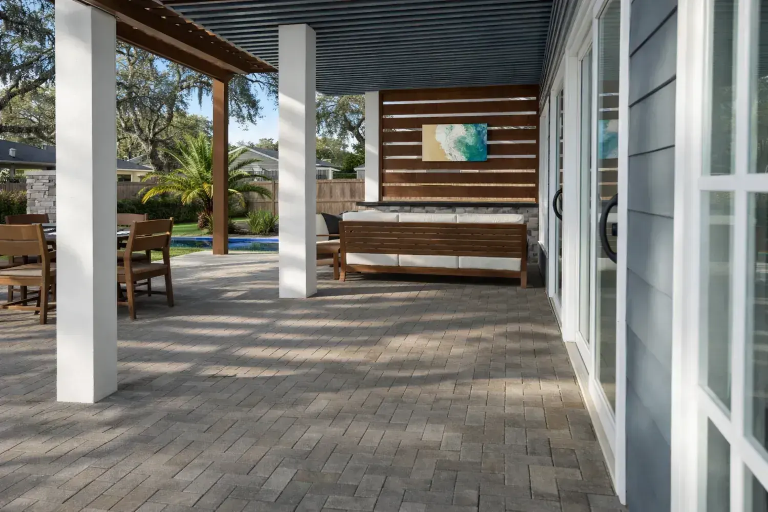 Covered outdoor living space designed by Serene Spaces Studio
