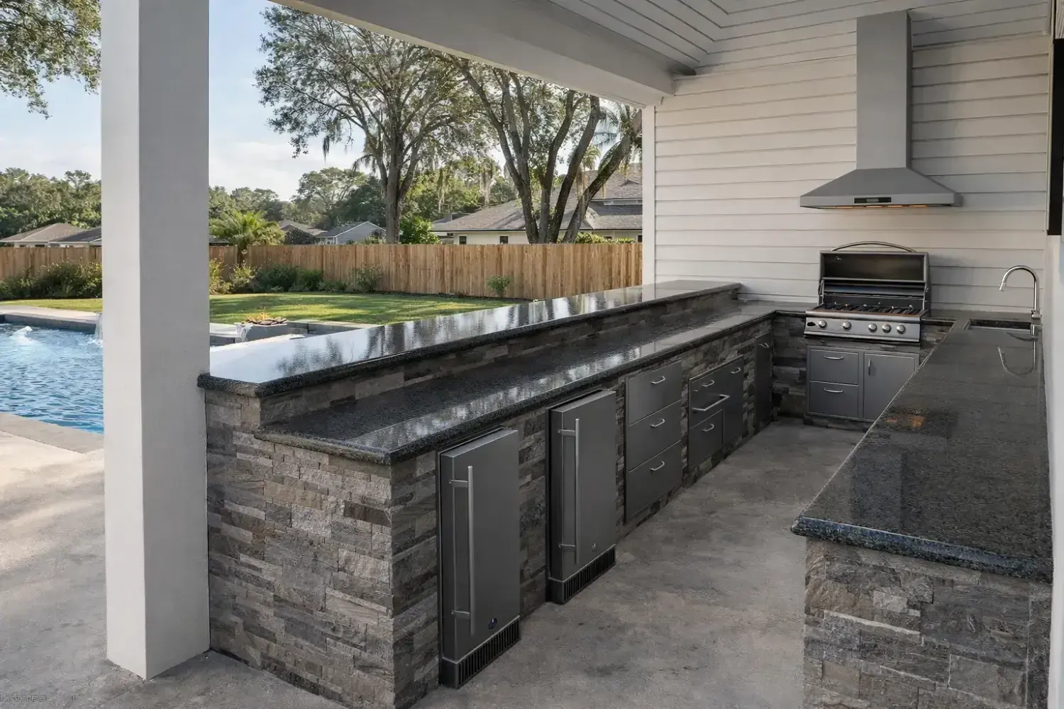 Outdoor kitchen and bar design by Serene Spaces Studio
